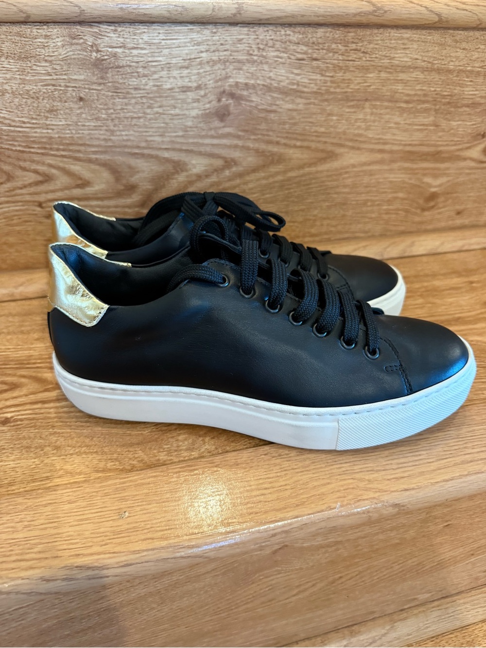 Vera Pelle Black Leather Sneakers with Gold Heel Accent